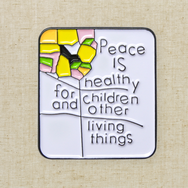 “Peace is Healthy for Children and Other Living Things” Enamel Pin